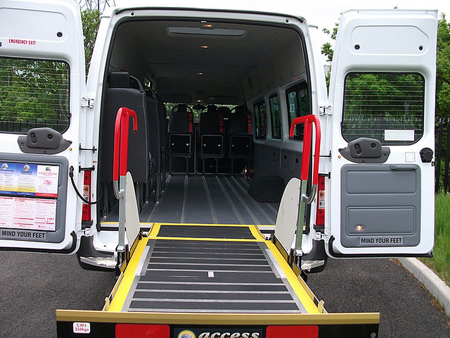 Accessible minibus with rear wheelchair ramp and tail-lift, fitted with wheelchair restraints, at our London training centre